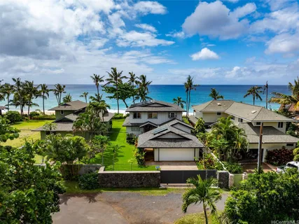 a front view of a house with a yard table and chairs