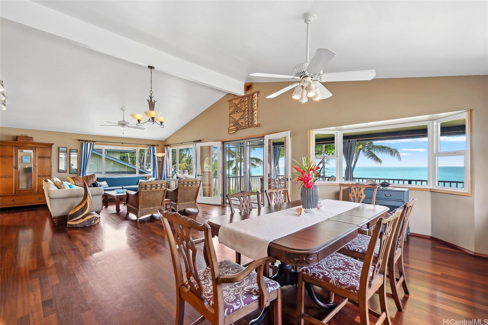 59-535 Ke Iki Road, Unit A Haleiwa, HI 96712 - Photo 8 of 25 a view of a dining room with furniture window and wooden floor