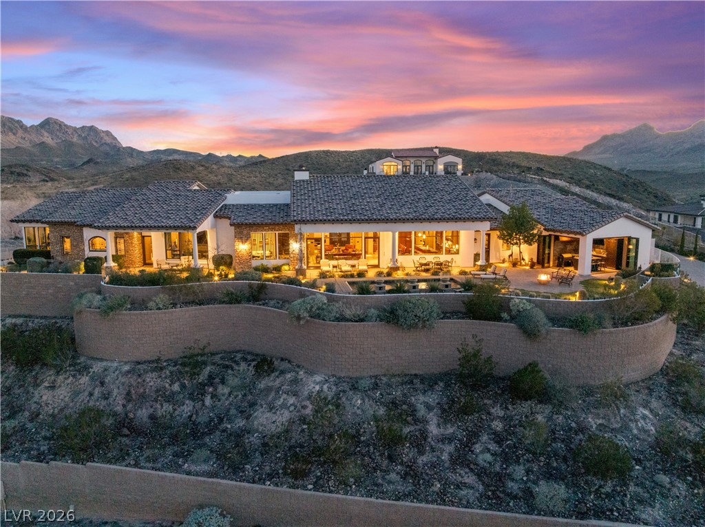 1123 Christian Road Henderson, NV 89002 - Photo 78 of 94 Grand estate home nestled on a hillside offers expansive outdoor living and mesmerizing mountain views.