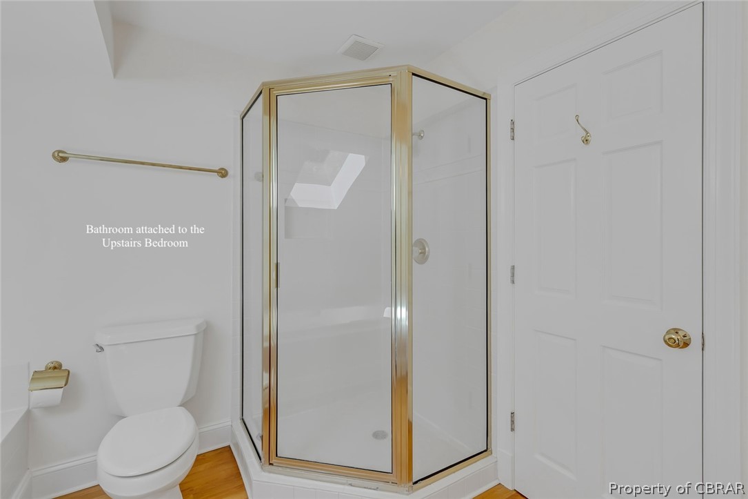 5818 Rivers Landing Terrace, Unit 5818 White Stone, VA 22578 - Photo 33 of 50 Bathroom with hardwood / wood-style flooring, toilet, and walk in shower