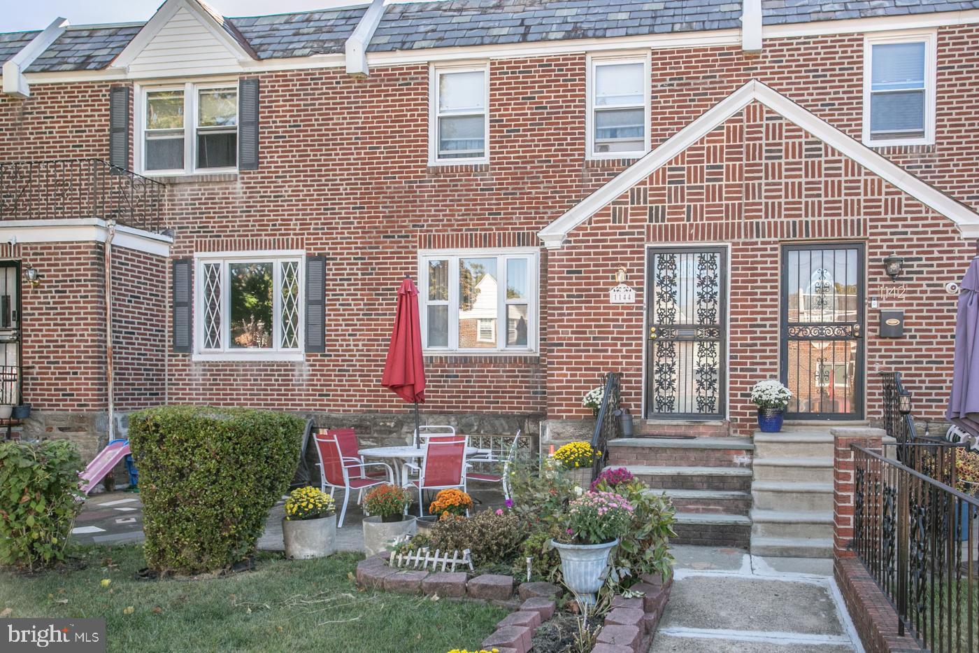 1144 Slocum Street Philadelphia, PA 19150 - Photo 1 of 27 a front view of a house with garden