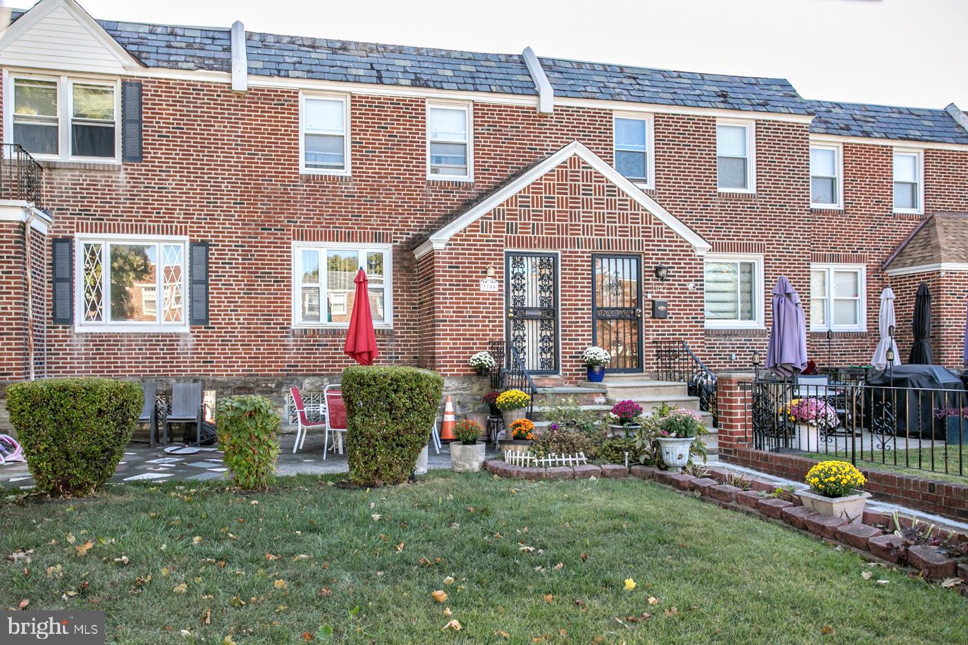 1144 Slocum Street Philadelphia, PA 19150 - Photo 27 of 27 a front view of house with yard and outdoor seating