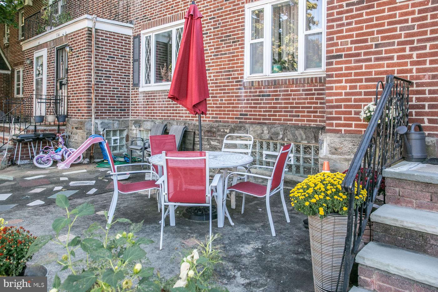 1144 Slocum Street Philadelphia, PA 19150 - Photo 3 of 27 a view of a chairs and table in a patio