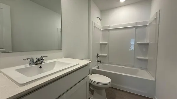 a bathroom with a sink a toilet and a bathtub