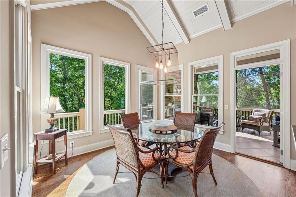 189 Red Trillium Ridge Big Canoe, GA 30143 - Photo 20 of 98 a view of a dining room with furniture large windows and wooden floor