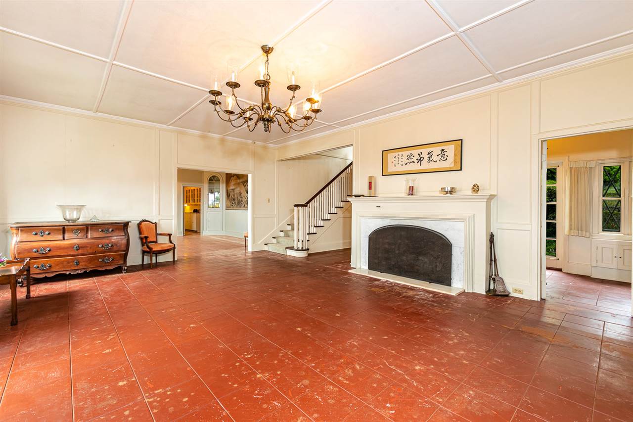 300 Kepa Road Kula, HI 96790 - Photo 18 of 30 a view of a livingroom with furniture a fireplace a chandelier and windows