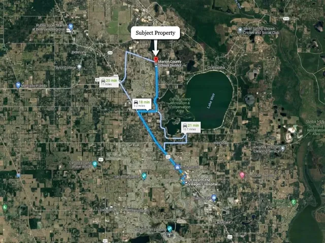 a view of a multi story building with a yard