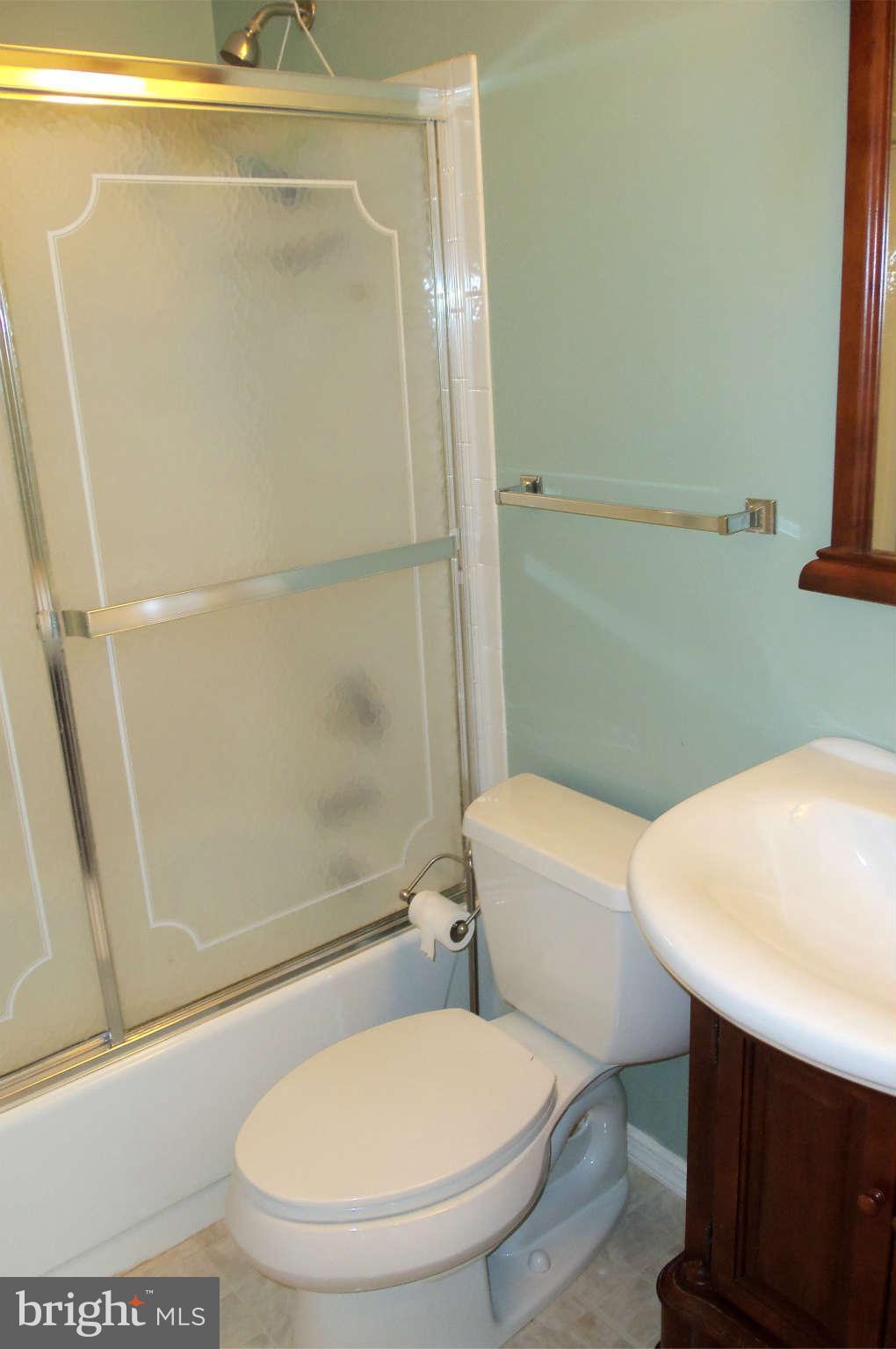 271 Silverleaf Court Arnold, MD 21012 - Photo 12 of 19 a white toilet sitting next to a bath tub