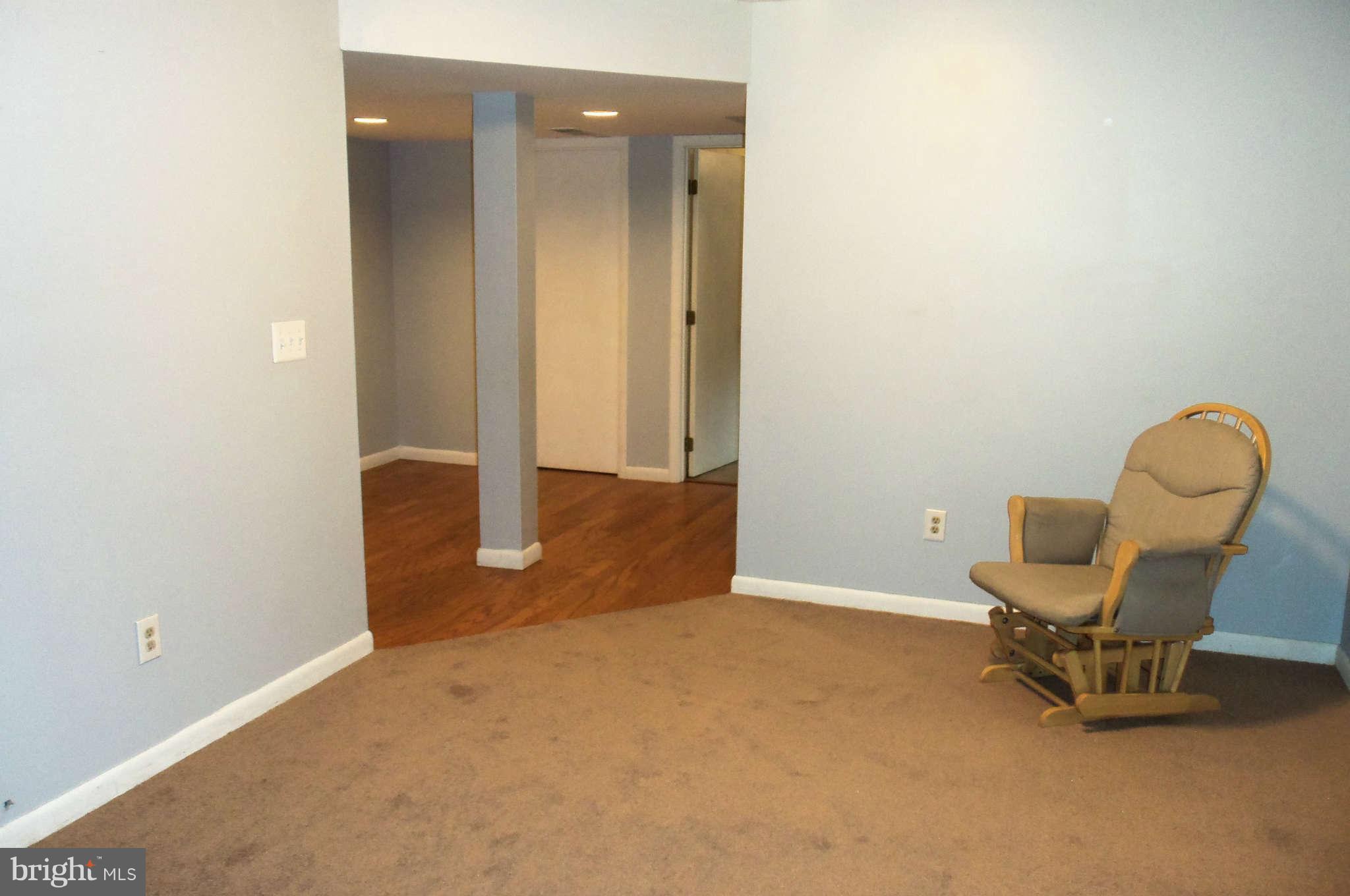 271 Silverleaf Court Arnold, MD 21012 - Photo 15 of 19 an empty room with chair and air conditioner vent