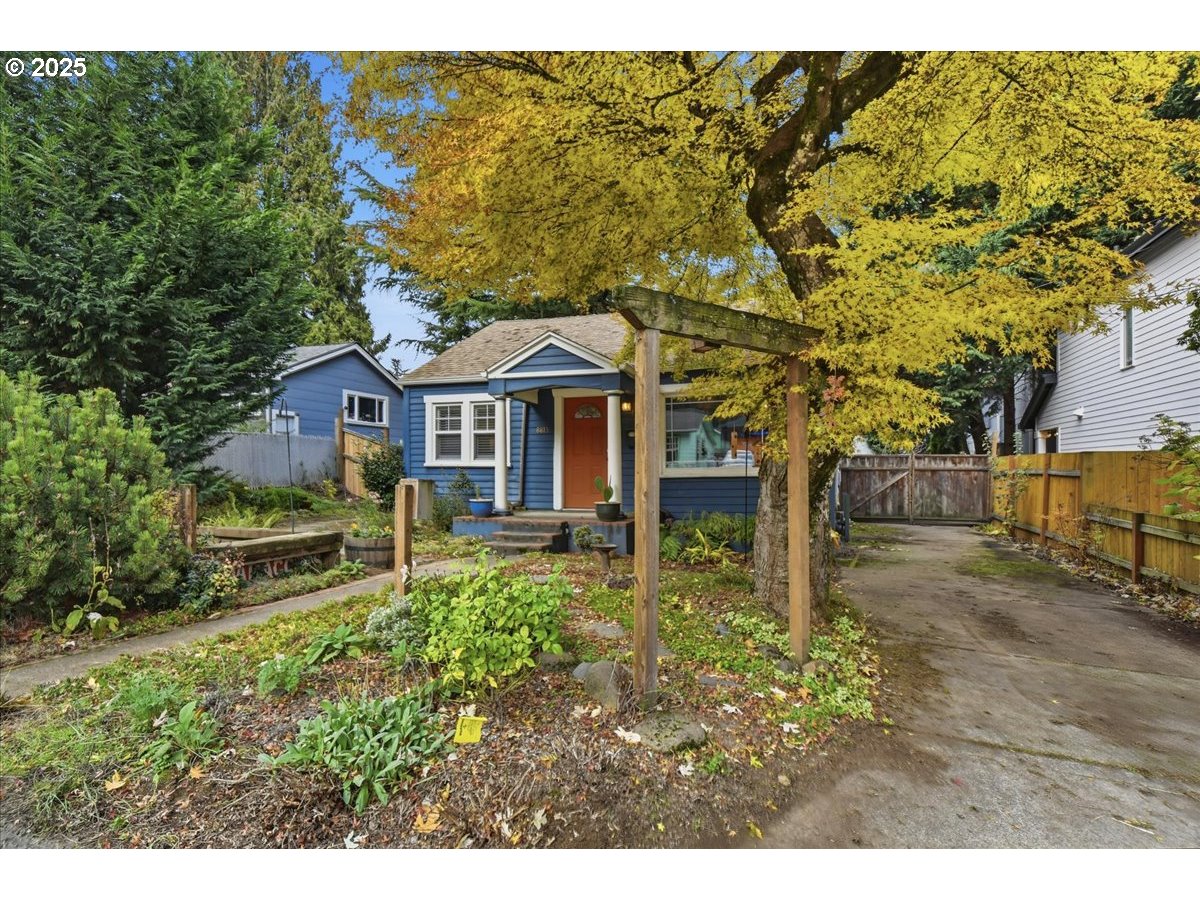 8813 Northeast Ward Street Portland, OR 97220 - Photo 26 of 32 a front view of a house with a yard