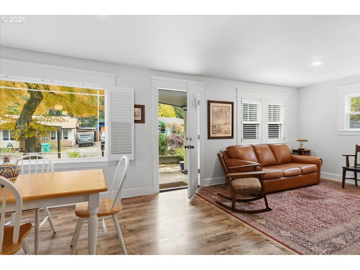 8813 Northeast Ward Street Portland, OR 97220 - Photo 4 of 32 a living room with furniture and a wooden floor