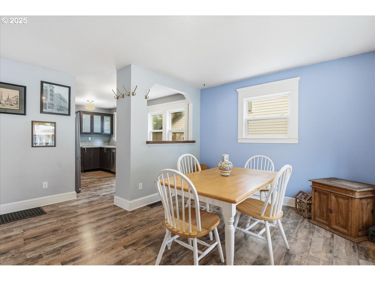 8813 Northeast Ward Street Portland, OR 97220 - Photo 8 of 32 a view of a dining room with furniture and wooden floor