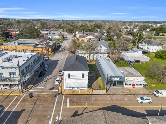 an aerial view of residential houses with outdoor space