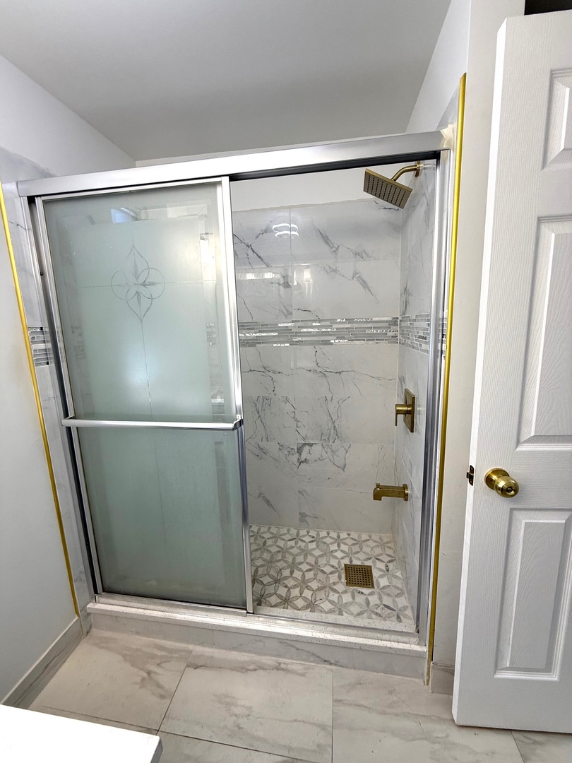4357 South Whipple Street, Unit 2 Chicago, IL 60632 - Photo 13 of 17 a bathroom with a glass shower door