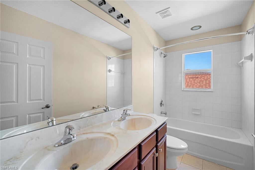 8542 Sumner Avenue, Unit 1 Fort Myers, FL 33908 - Photo 15 of 18 a bathroom with a sink and a bathtub