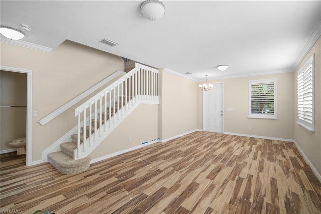 8542 Sumner Avenue, Unit 1 Fort Myers, FL 33908 - Photo 3 of 18 a view of a livingroom with wooden floor and window