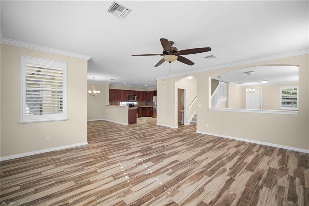 8542 Sumner Avenue, Unit 1 Fort Myers, FL 33908 - Photo 4 of 18 a view of empty room with wooden floor and fan