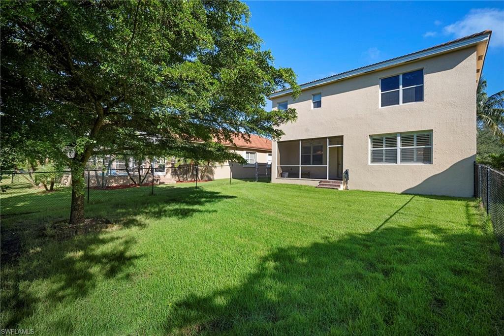 8542 Sumner Avenue, Unit 1 Fort Myers, FL 33908 - Photo 9 of 18 a view of house with a backyard
