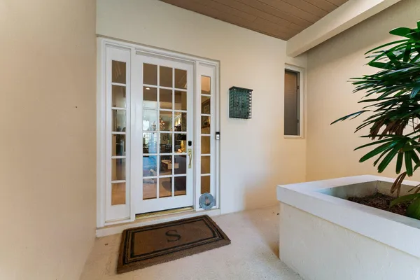 a room with furniture and view of bathroom