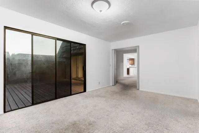 a view of an empty room with a window