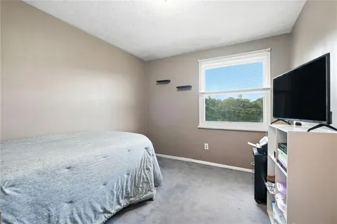 a view of an empty room with a fireplace
