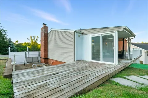 a view of deck with wooden floor and fence