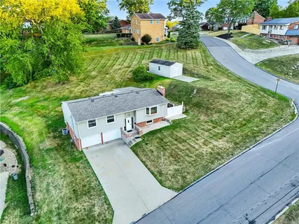 an aerial view of a house having yard