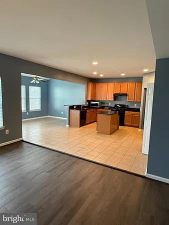 a view of a kitchen with a sink and cabinets