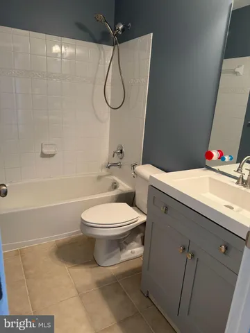 a bathroom with a toilet sink and shower