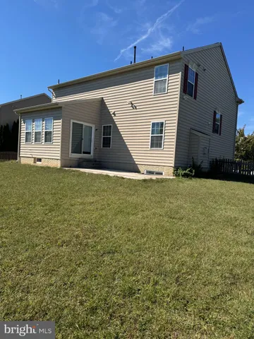 a house that has a big yard in front of it