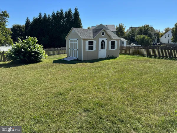 a house with a garden in the background