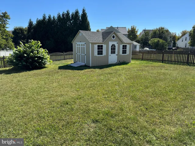 a house with a garden in the background