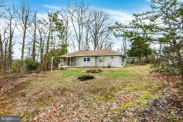 a house with trees in the background