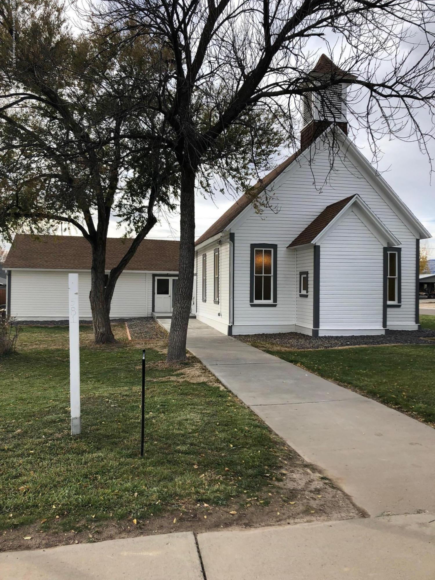 581 Denver Avenue De Beque, CO 81630 - Photo 2 of 5 a front view of house with garden