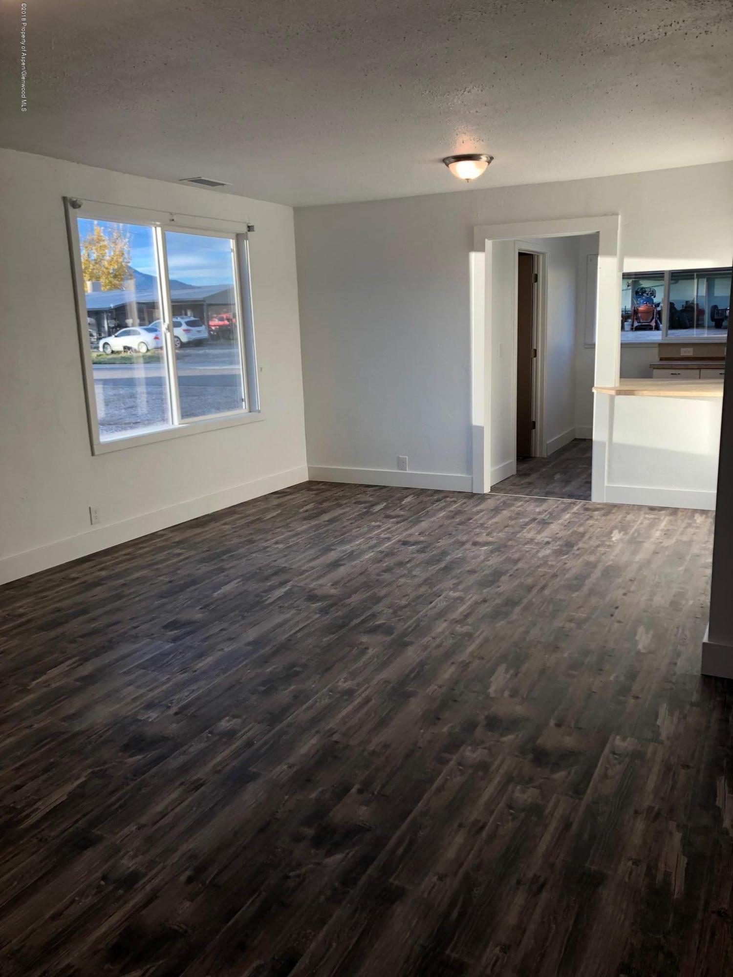 581 Denver Avenue De Beque, CO 81630 - Photo 5 of 5 a view of an empty room with a window