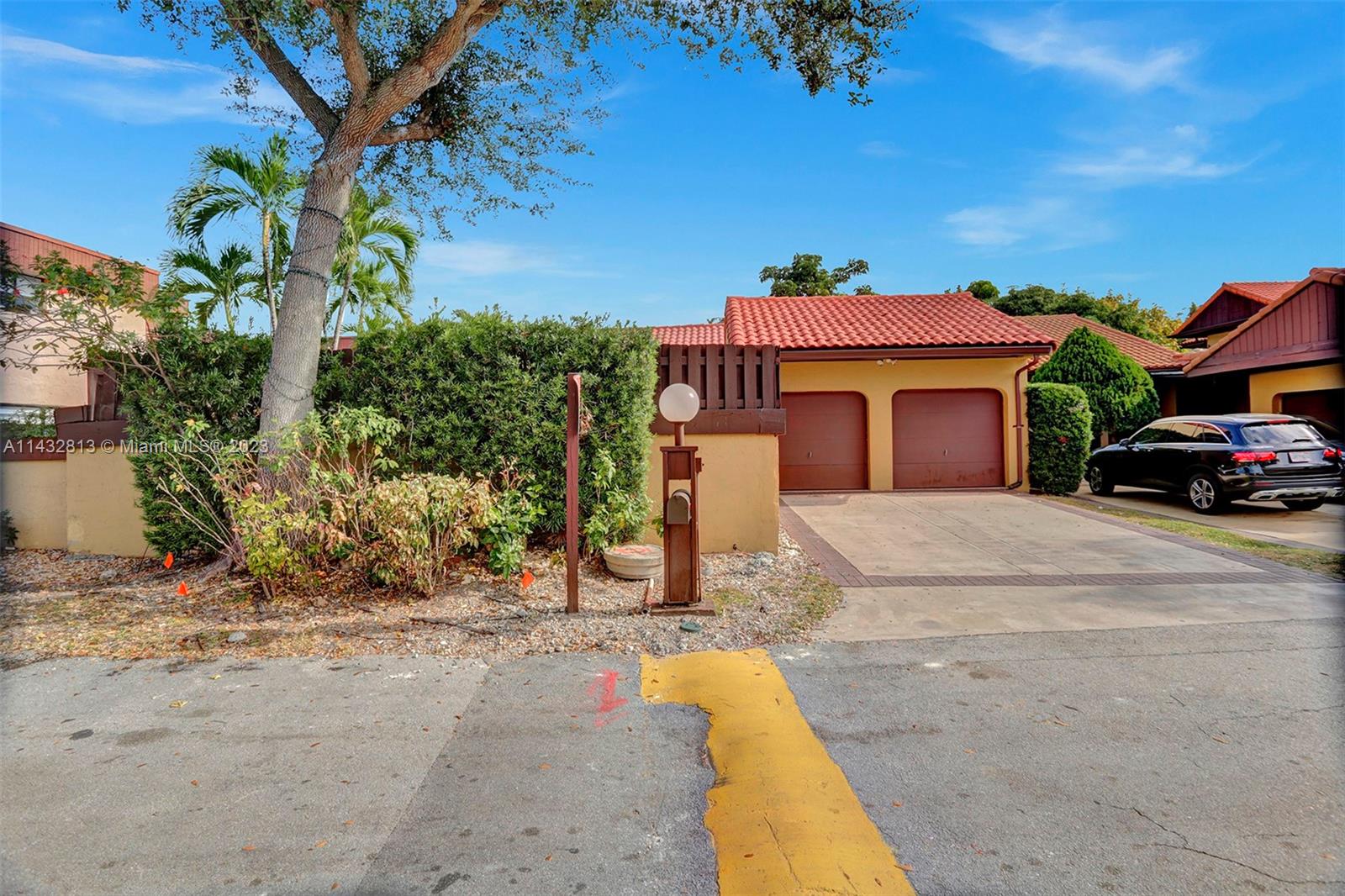 20429 Northeast 10th Ct Road Miami, FL 33179 - Photo 1 of 42 a car parked in front of a house