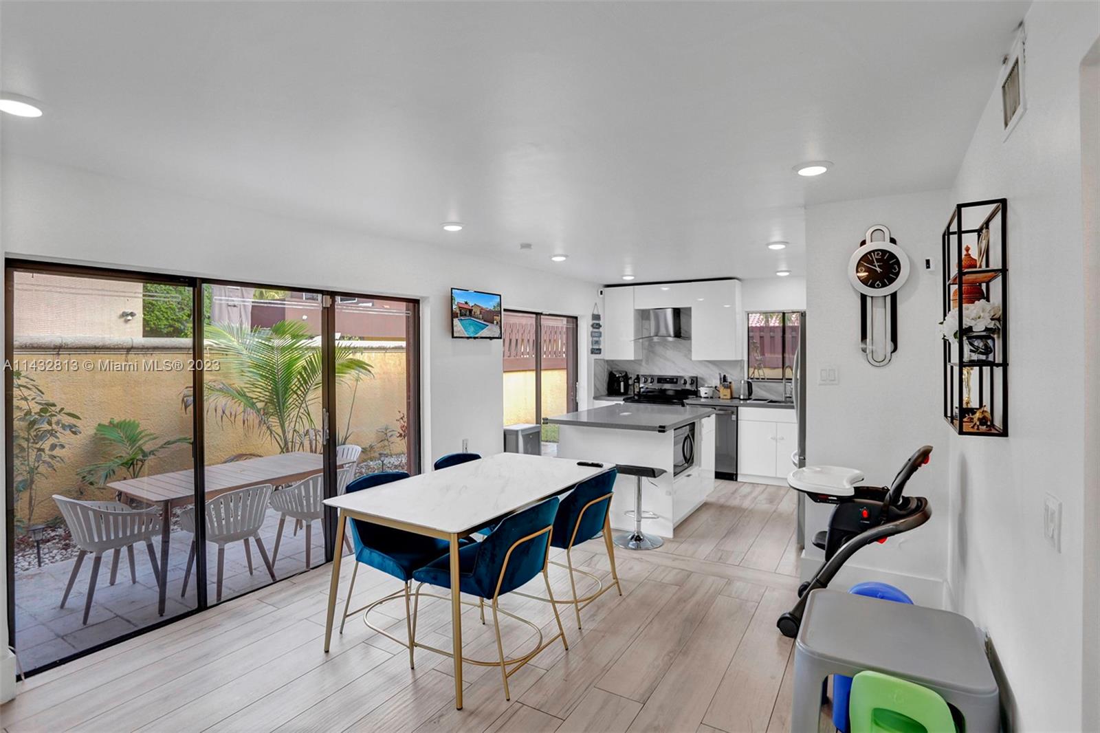 20429 Northeast 10th Ct Road Miami, FL 33179 - Photo 12 of 42 a view of a livingroom with furniture window and wooden floor
