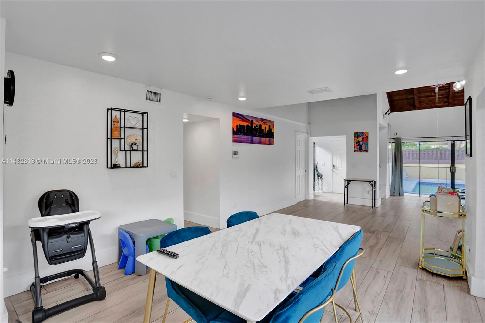 20429 Northeast 10th Ct Road Miami, FL 33179 - Photo 16 of 42 a living room with furniture and a wooden floor