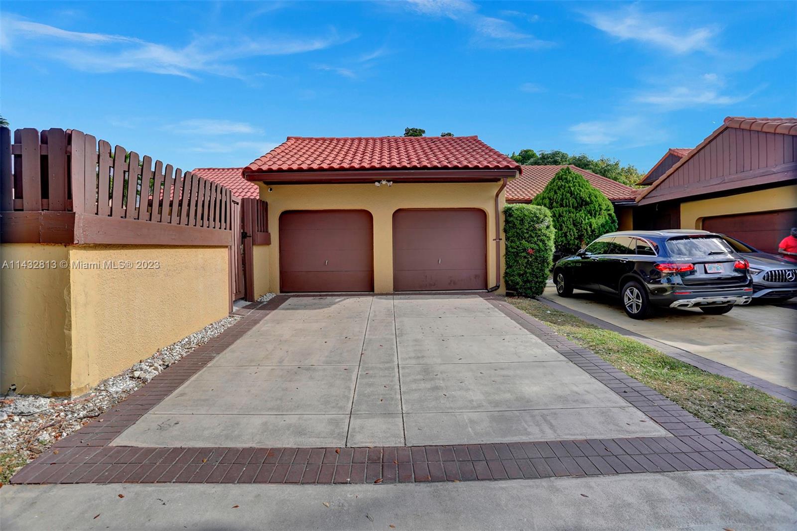 20429 Northeast 10th Ct Road Miami, FL 33179 - Photo 3 of 42 a view of a car park in front of a house