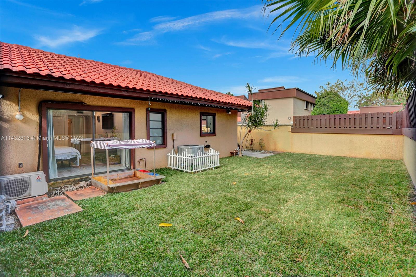20429 Northeast 10th Ct Road Miami, FL 33179 - Photo 32 of 42 a view of a house with a yard porch and furniture