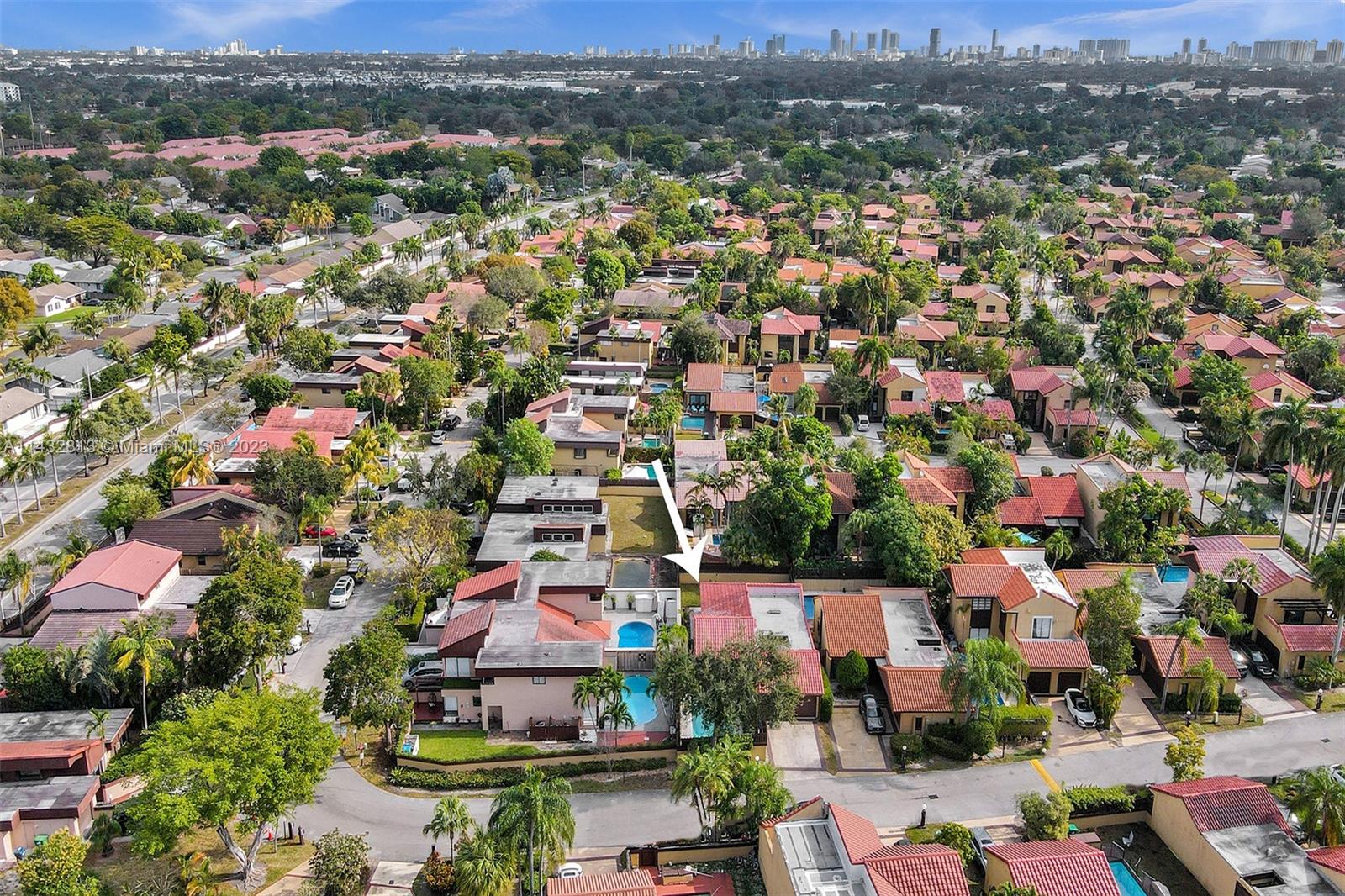 20429 Northeast 10th Ct Road Miami, FL 33179 - Photo 39 of 42 an aerial view of a houses with a swimming pool