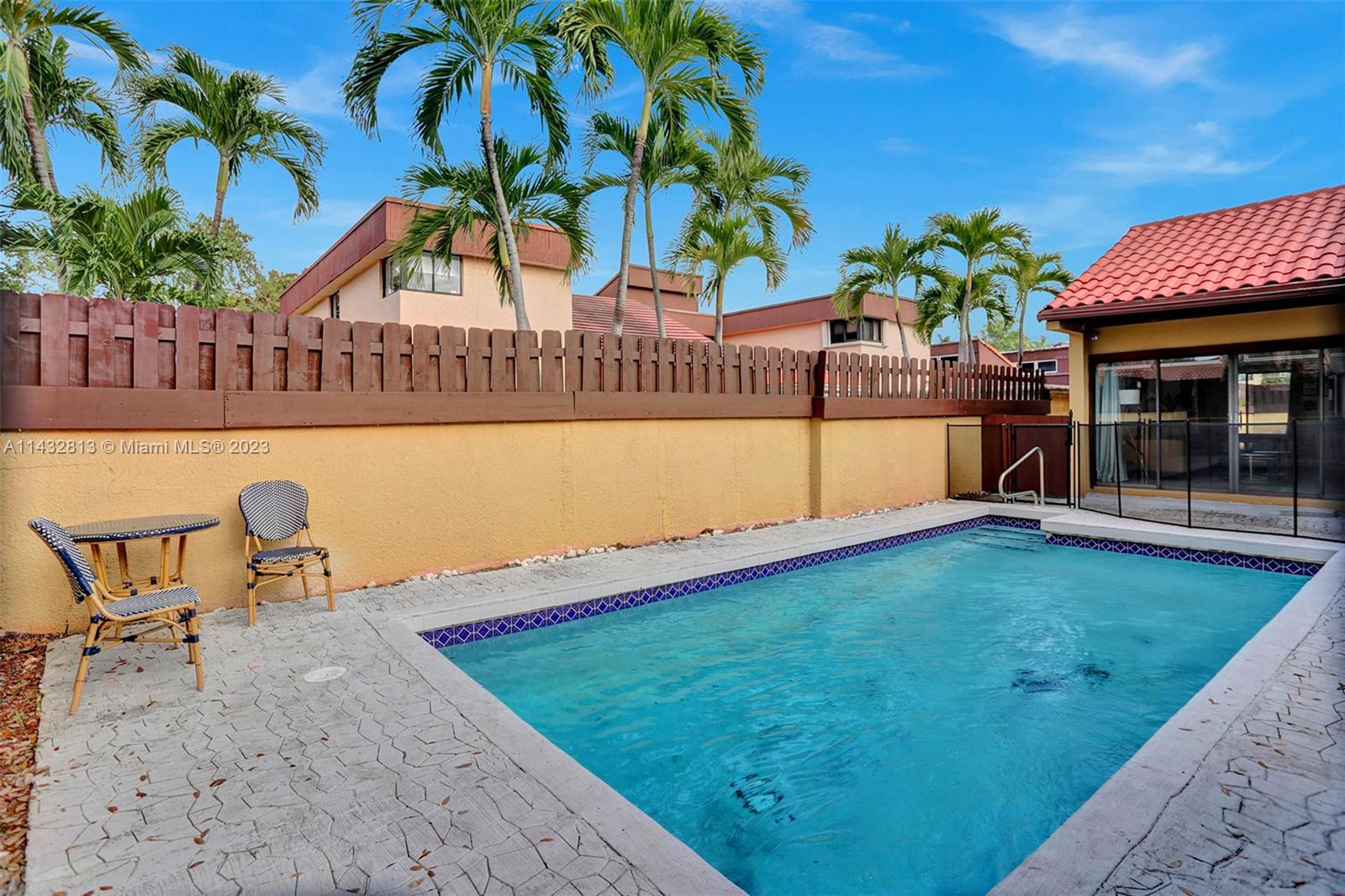 20429 Northeast 10th Ct Road Miami, FL 33179 - Photo 4 of 42 a view of a swimming pool with a lounge chair