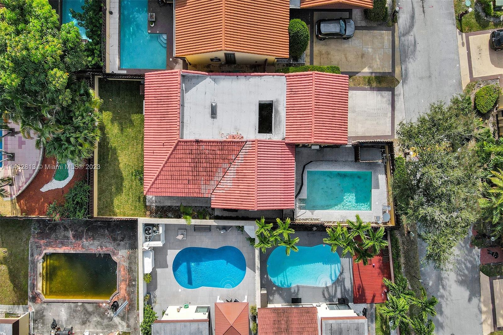 20429 Northeast 10th Ct Road Miami, FL 33179 - Photo 41 of 42 an aerial view of a house with a yard and balcony