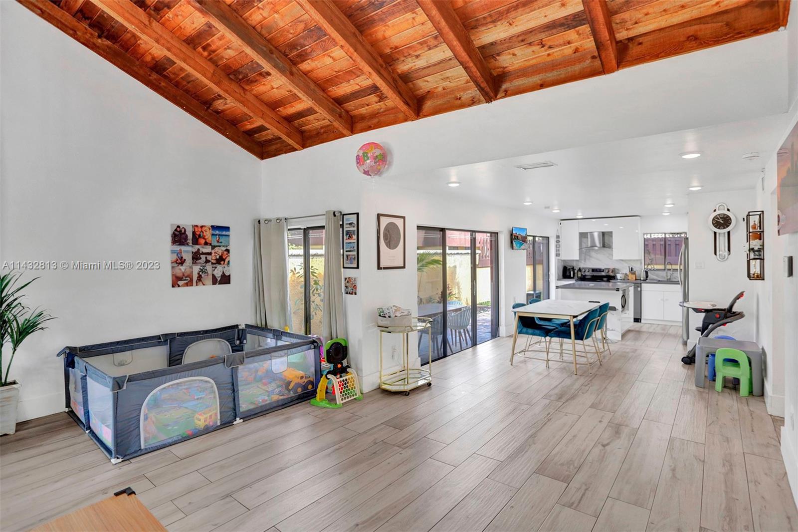 20429 Northeast 10th Ct Road Miami, FL 33179 - Photo 7 of 42 a living room with furniture and a wooden floor