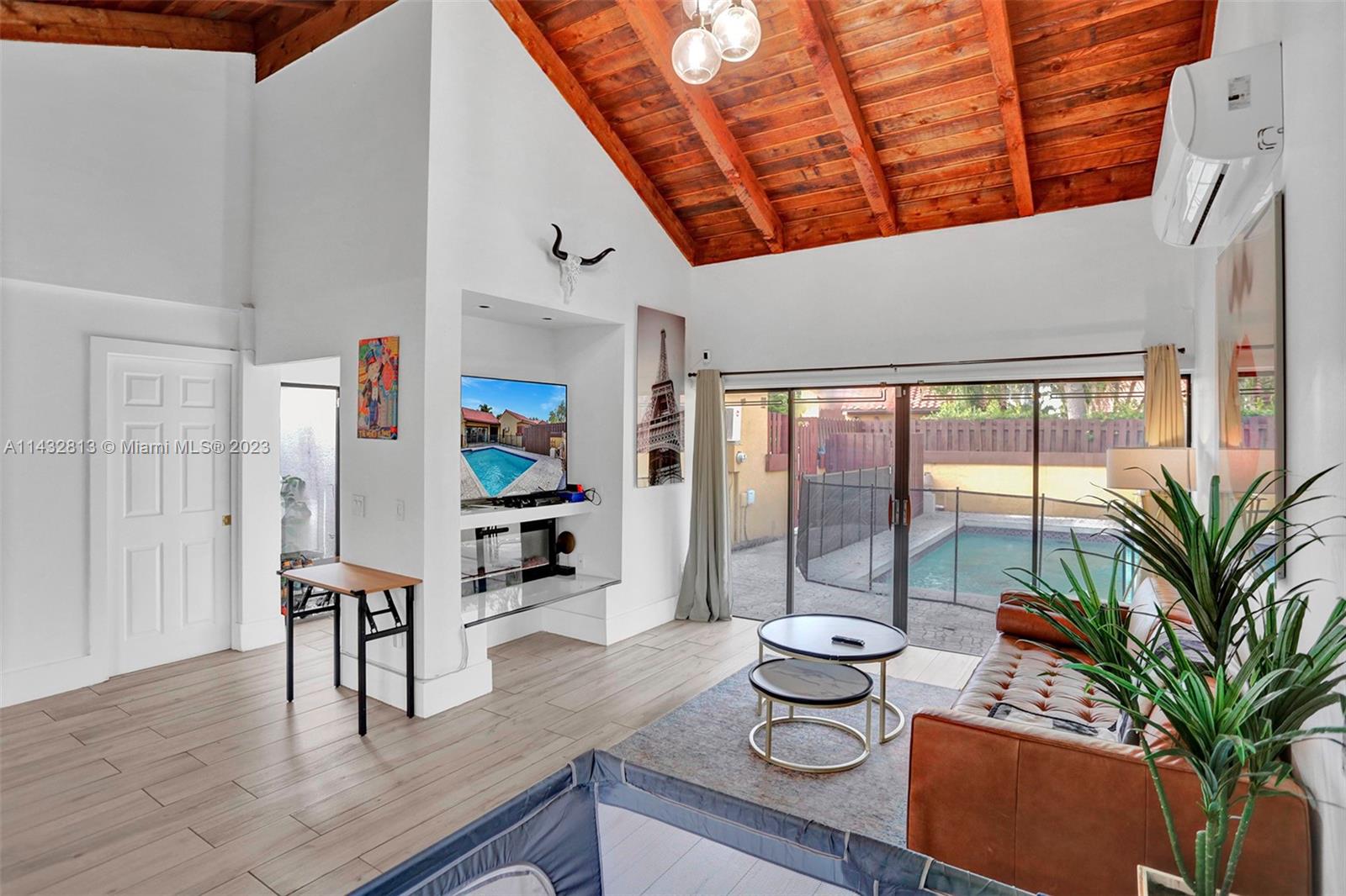 20429 Northeast 10th Ct Road Miami, FL 33179 - Photo 8 of 42 a dining room with furniture and wooden floor