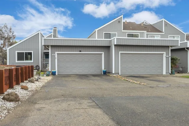 a front view of a house with a garage
