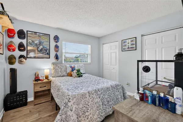 a bedroom with bed and a window