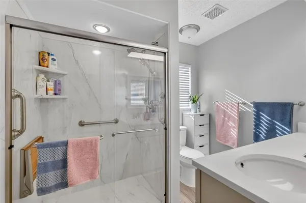 a bathroom with a bathtub and a shower