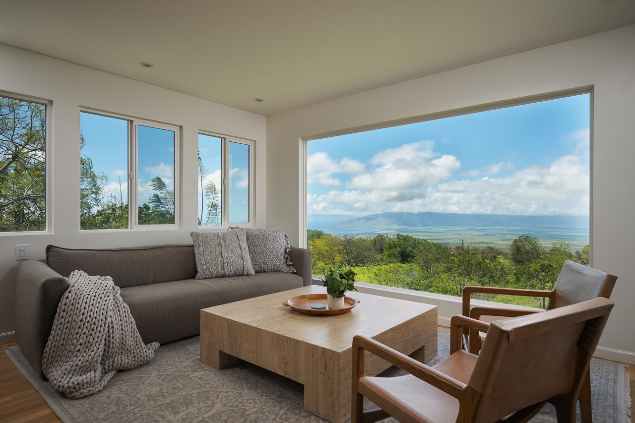 Undisclosed Address Kula, HI 96790 - Photo 13 of 50 a living room with furniture and a floor to ceiling window