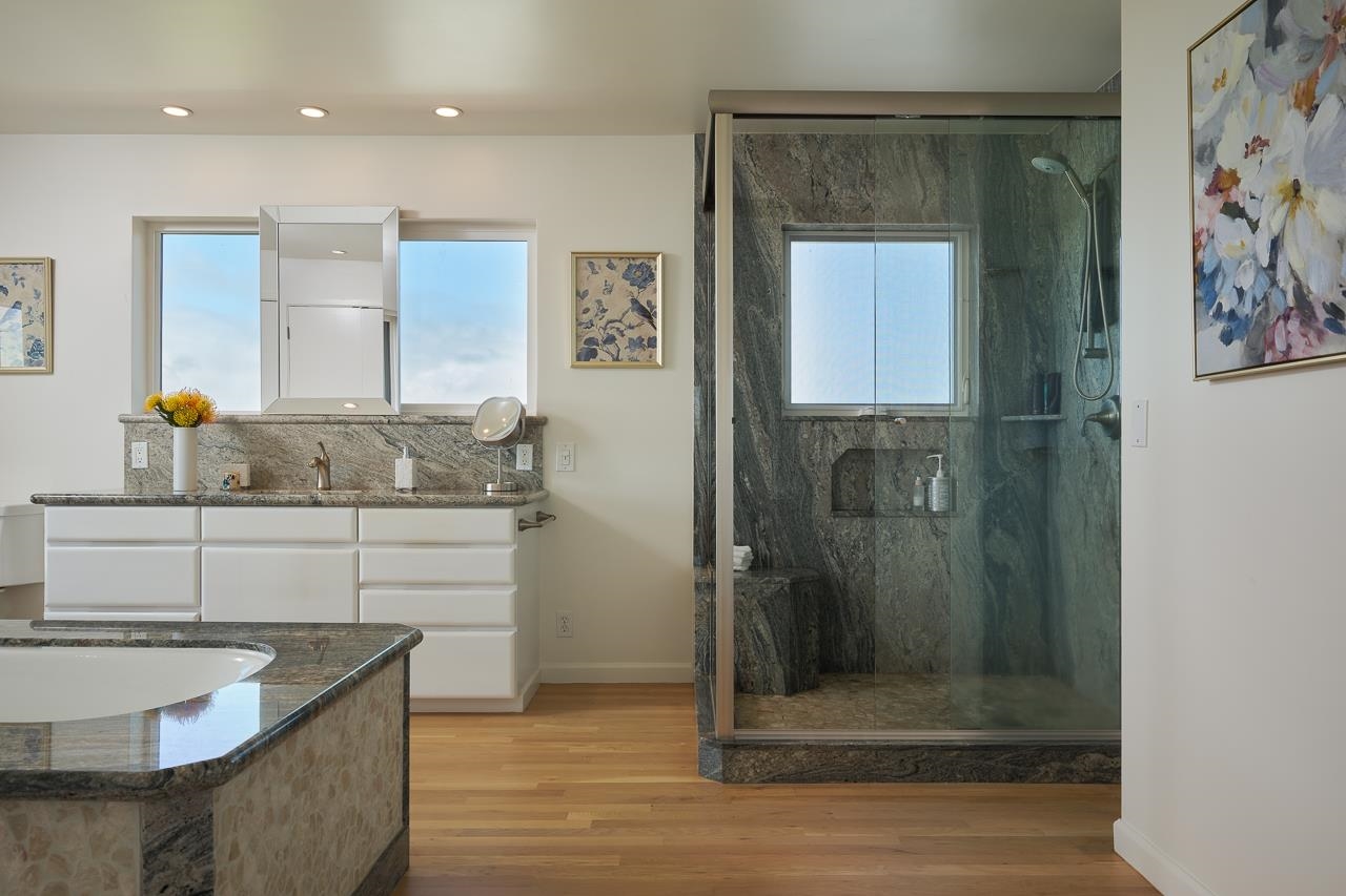Undisclosed Address Kula, HI 96790 - Photo 20 of 50 a bathroom with a granite countertop sink a mirror and shower